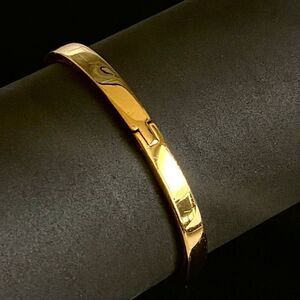 APV Kate Spade Gold tone Push -close High Polish Bracelet.